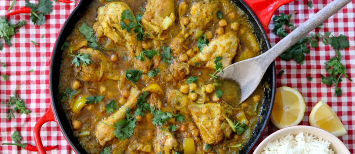 yellow pukka curry in red skillet